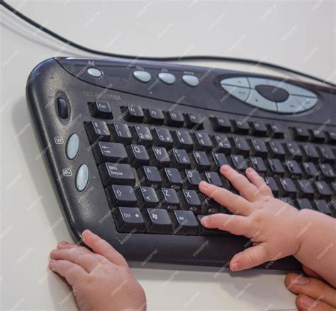 Premium Photo | Hand of a baby with the computer keyboard