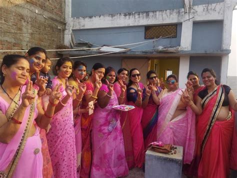 Greeting Each Other On The Festival Of Colors By Applying Gulal Women Played Holi With Flowers