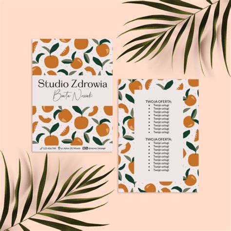 Two Business Cards With Oranges On Them And Palm Leaves In The