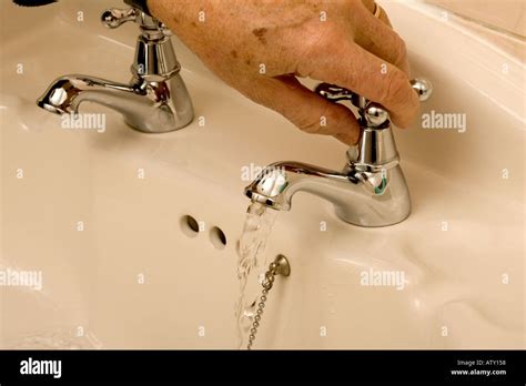 Hand Turning Tap Stock Photos Hand Turning Tap Stock Images Alamy