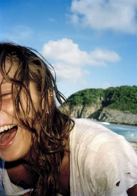 A Woman With Her Mouth Open On The Beach