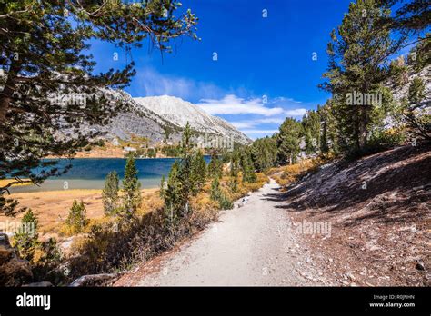 Hiking trail following the shoreline of Long Lake, Little Lakes Valley trail, John Muir ...