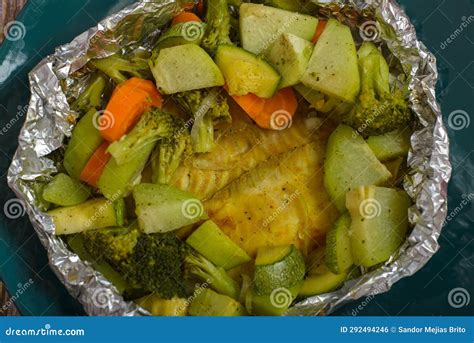 Baked Fish With Vegetables In Aluminum Foil Stock Photo Image Of