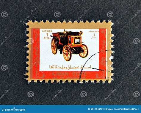 Cancelled Postage Stamp Printed By Ajman That Shows Antique Vehicle