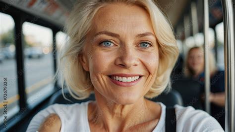 Close Up Selfie Of A Smiling Elderly Blonde Woman With Blue Eyes On A