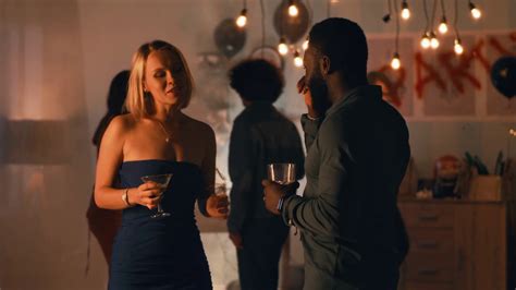 Drunk Blond Woman With Cocktail Talking And Flirting With Black Man While Having Fun During Home