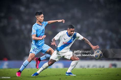 Malcom Philipe Oliveira of Al Hilal SFC and Lalengmawia Ralte of ...