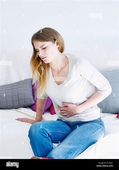 WOMAN WITH ABDOMINAL PAIN Stock Photo - Alamy