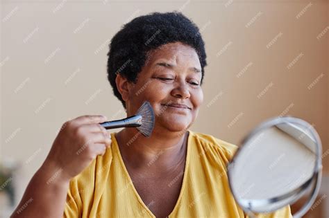 Premium Photo Smiling African American Woman Touching Her Face With Brush