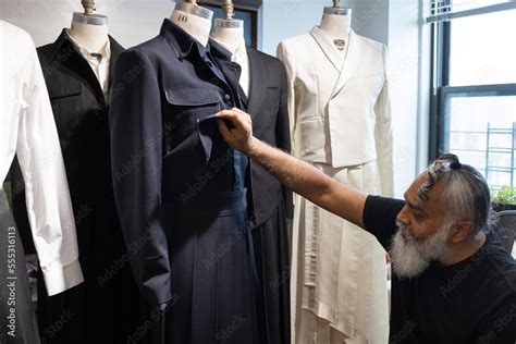 bearded man designing tailored fashion in his studio Stock Photo | Adobe Stock