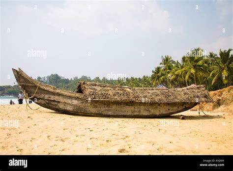 Fishing boat on Kovalam Beach, Kovalam, Kerala, India Stock Photo - Alamy