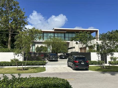 David Beckham smiles as he visits his new $77 million mansion in Miami