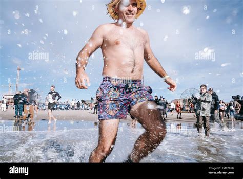 A Woman Reacts To The Shock Of Cold Water Hundreds Of People