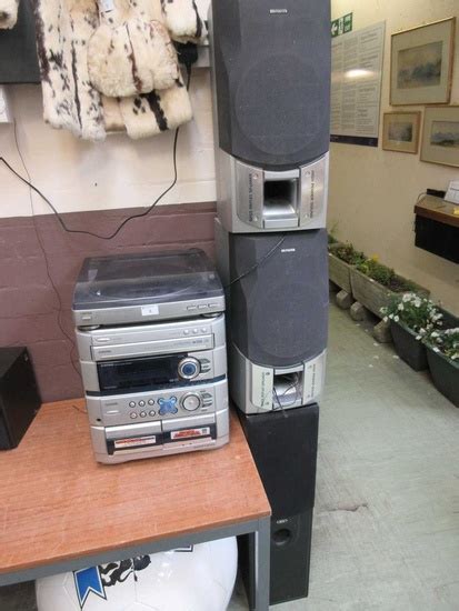 An AIWA stereo system together with a pair of matching... in...