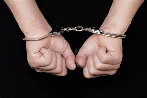 Criminal Hands Locked In Handcuffs Close Up View Stock Image Image Of Handcuffs Concept