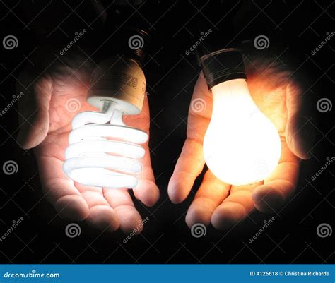 Comparing Fluorescent And Incandescent Light Bulbs Stock Photo Image