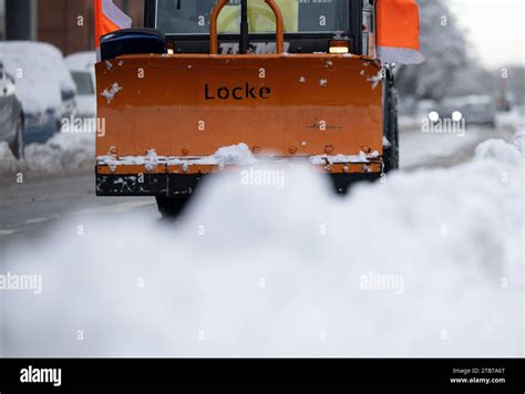 Munich, Germany. 05th Dec, 2023. A snow plow drives over a road. Snow ...