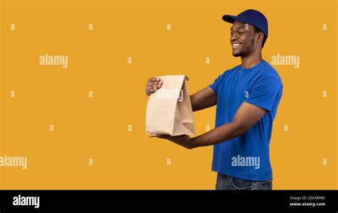 Black Delivery Man Holding Package Hi Res Stock Photography And Images