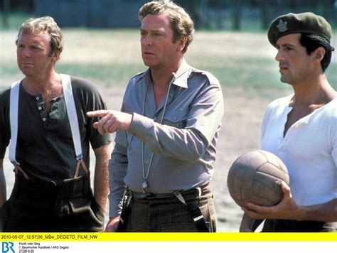 Bobby Moore, Michael Caine and Sly Stallone on the set of Escape to ...