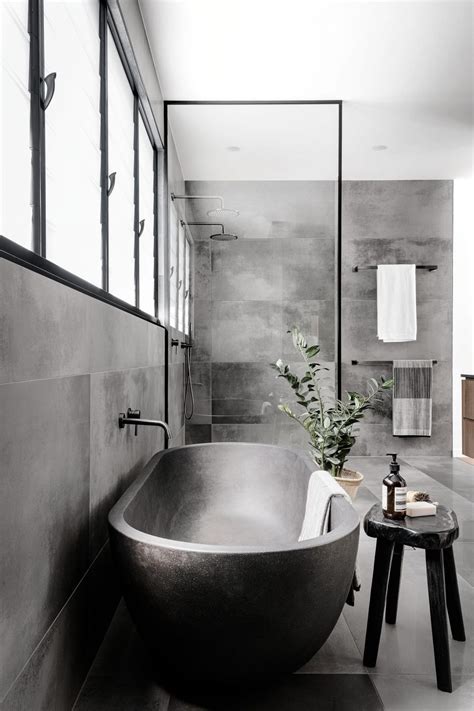 A Cloudy Grey Tile Sets The Palette For This Bathroom