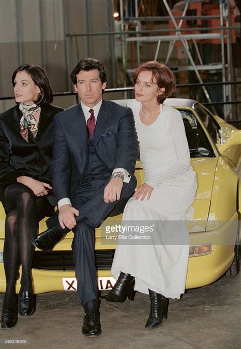 Irish Actor Pierce Brosnan Poses With His Co Stars Famke Janssen And