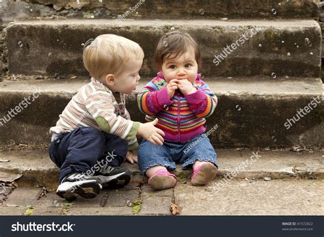 Young Boy Giving Sad Baby Girl Stock Photo 41572822 - Shutterstock