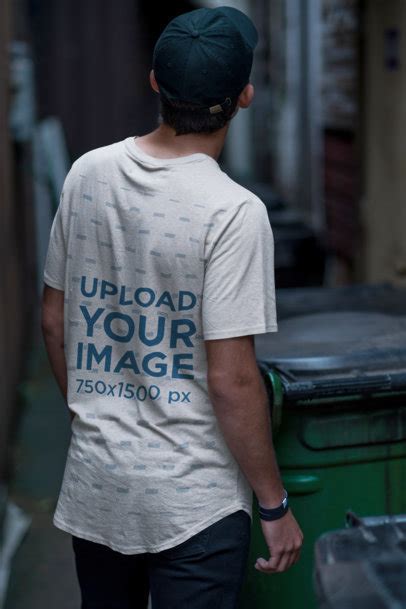 Placeit Back View T Shirt Mockup Featuring A Man In An Alley