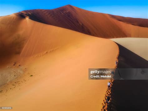 Climbing On Big Daddy Sand Dunes Sossusvlei Namibnaukluft National Park Namibia High Res Stock