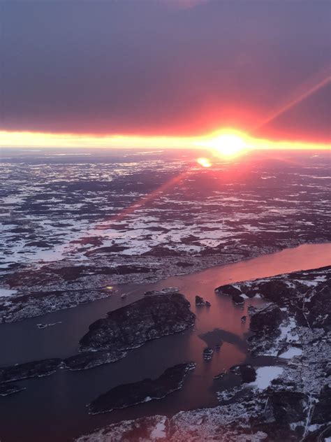 Winter sunrise on a morning flight. Norway. : r/pics