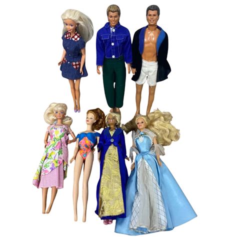 7 Vintage Barbie And Ken Dolls With Assorted Clothes And Accessories