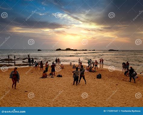 Big Crowd Looking On The Sunset At Ocean Beach On Tropical Island