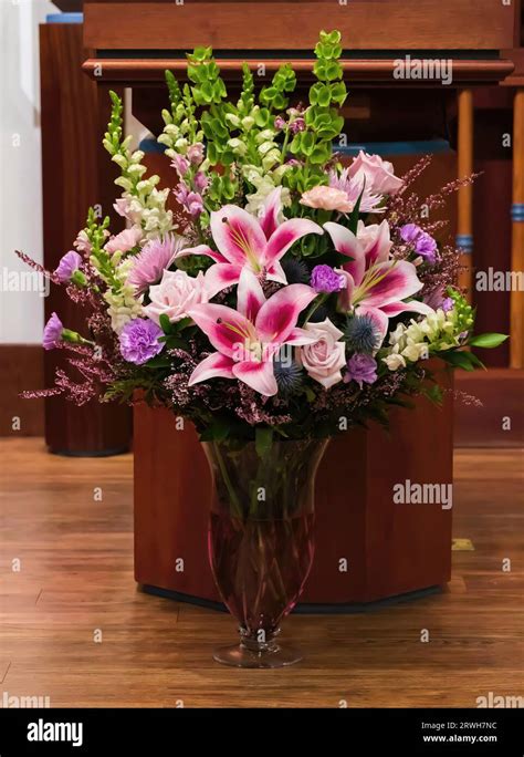 Beautiful Flower Arrangement In A Lovely Vase With Pink Stargazer