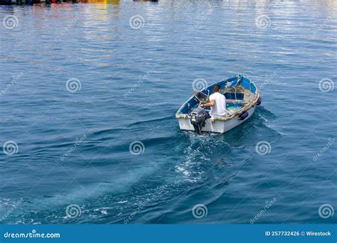 Man Driving A Boat In The Sea Stock Photo Image Of Boat Driving