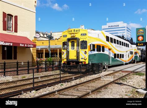 Sunrail Train And Engine Travelling Through Church Street Station Stock