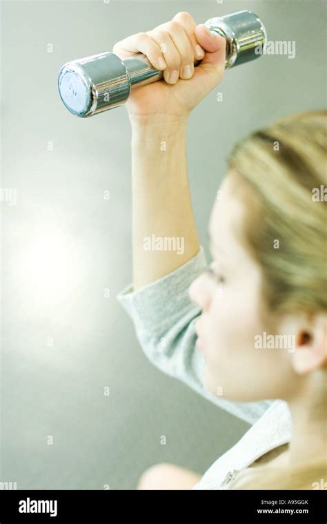 Woman Lifting Dumbbell Stock Photo Alamy