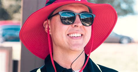 Man Wearing Red Hat And Black Polo Shirt · Free Stock Photo