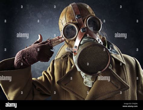 Grunge Portrait Man In Gas Mask Pointing Hand Gun At His Own Head