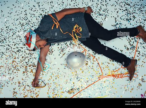 I Think I Overdid It High Angle Shot Of A Drunk Young Man Passed Out Of The Dance Floor During