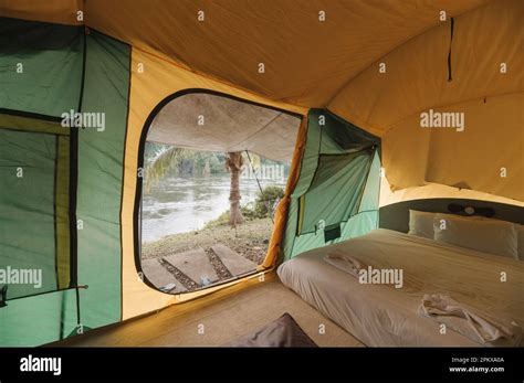 Inside of large comfortable camping tent on campground in the tropical ...