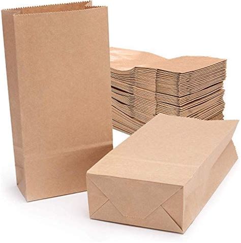 Brown Paper Bags Are Stacked On Top Of Each Other And Ready To Be Used