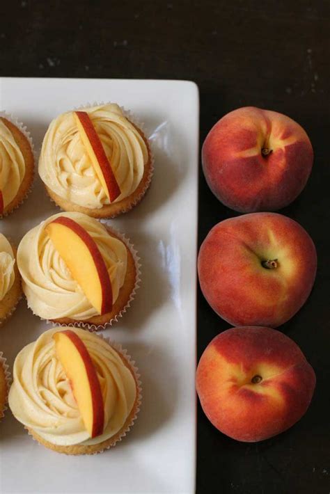 This recipe makes perfect peach cupcakes topped with a light, fresh ...