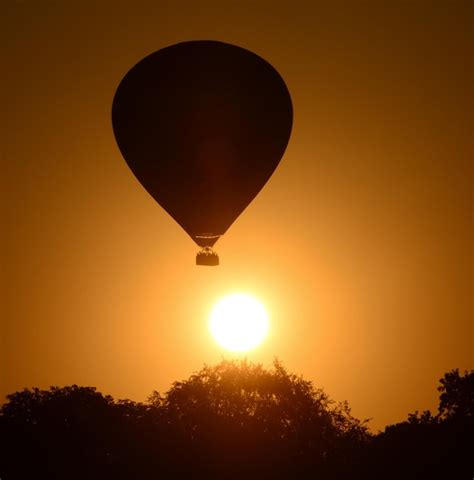 Silhouette Hot Air Balloon Against Sky During Sunset Premium Ai