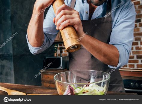 Man Making Salad Stock Photo By ©alexlipa 162010008