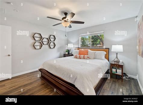 Home bedroom with large windows Stock Photo - Alamy