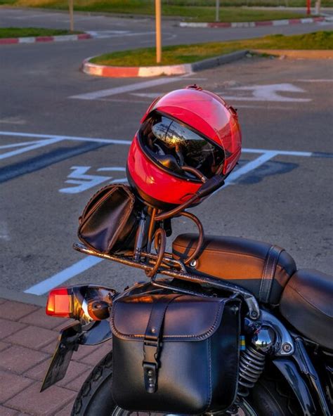 Premium Photo | Red helmet on a black motorcycle