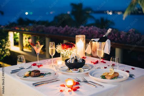 Romantic candlelight dinner luxury table setup for couple with ...