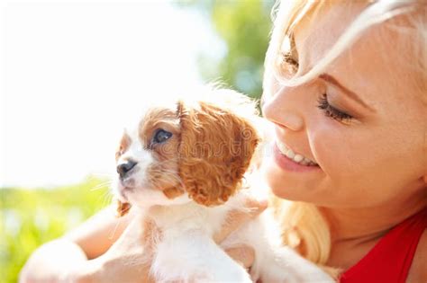 My Puppy Knows Hes Loved A Beautiful Blonde Hugging A Cute Puppy With Copyspace Stock Photo