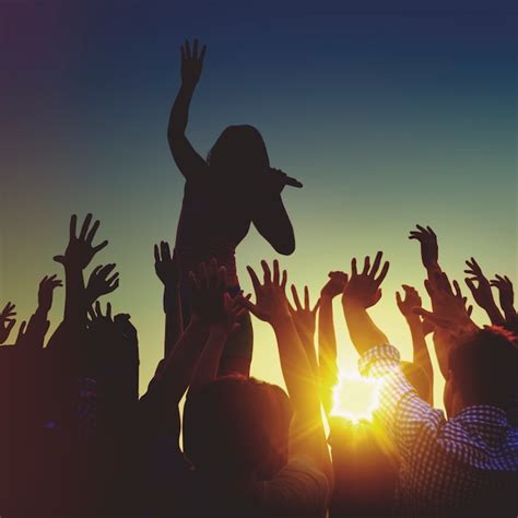 Premium Photo Silhouettes Of A Music Concert At Sunset