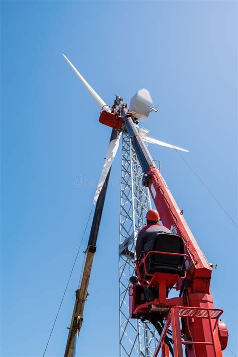 Worker Operator Of The Aerial Platform At The Workplace Installation