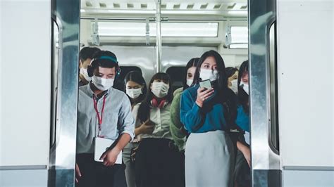 Premium Photo People Wearing Face Masks On A Crowded Public Subway Train